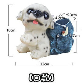Small white and black spotted ceramic puppy with blue denim pocket planter attached on back, 12cm wide, 10cm tall.