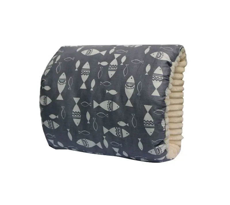 Dark blue nursing arm pillow with white fish pattern and soft beige interior lining.