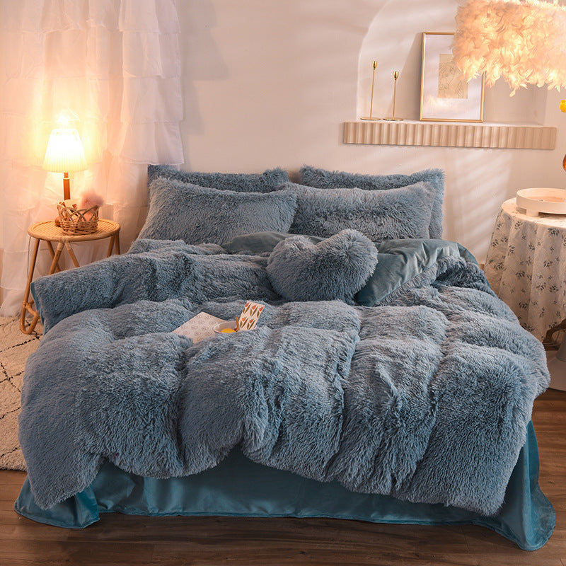 Plush thick fleece duvet cover set in muted blue with matching pillowcases on bed.