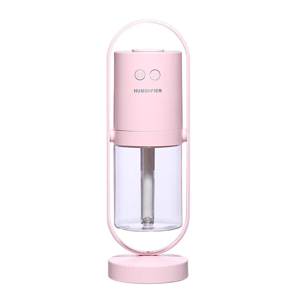 Pink USB ultrasonic air humidifier with cylindrical water tank and oval frame stand.