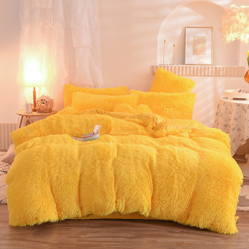 Fluffy bright yellow thick fleece duvet cover set with matching pillowcases on bed.