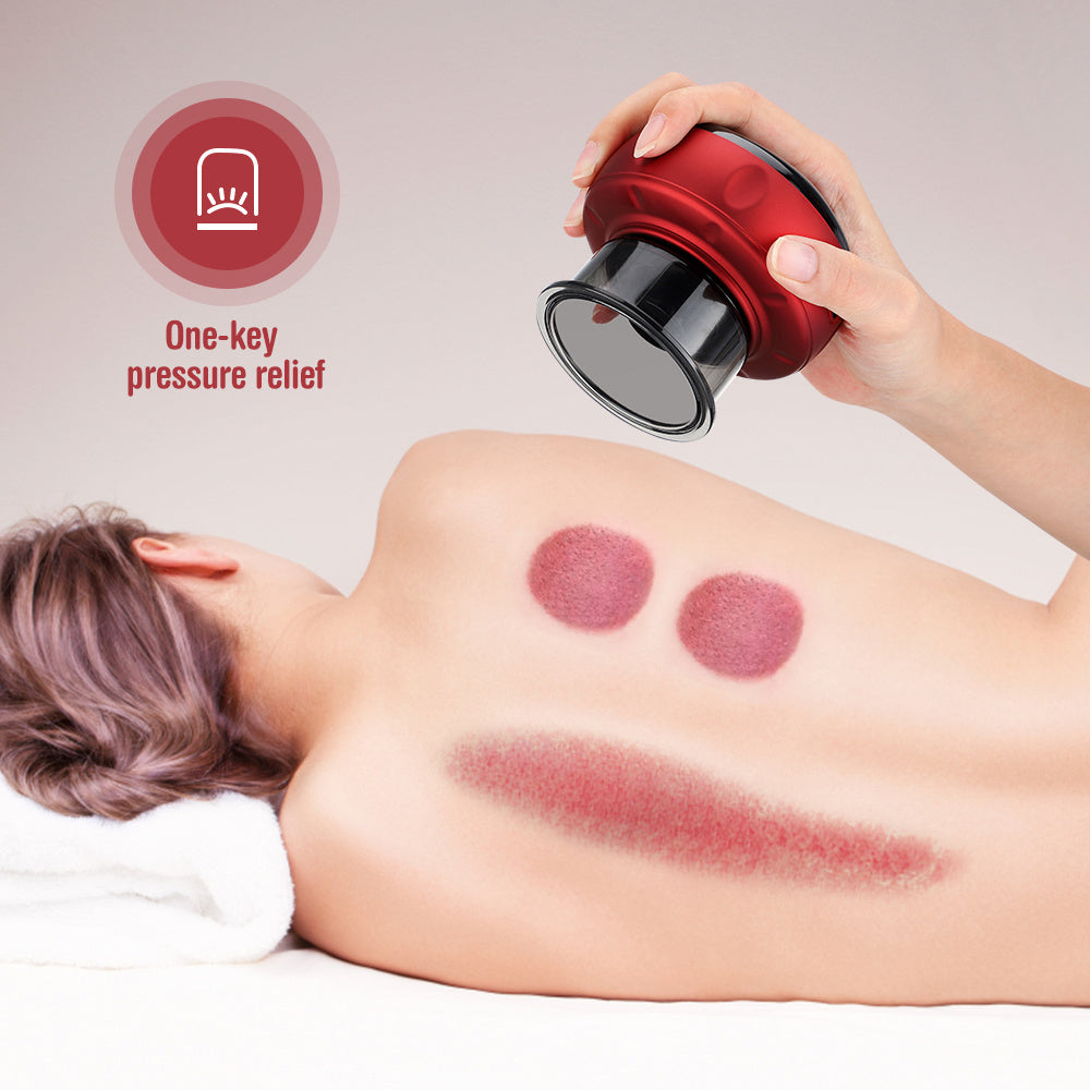Red electric vacuum cupping massager held over back with suction cups and scraped skin marks.