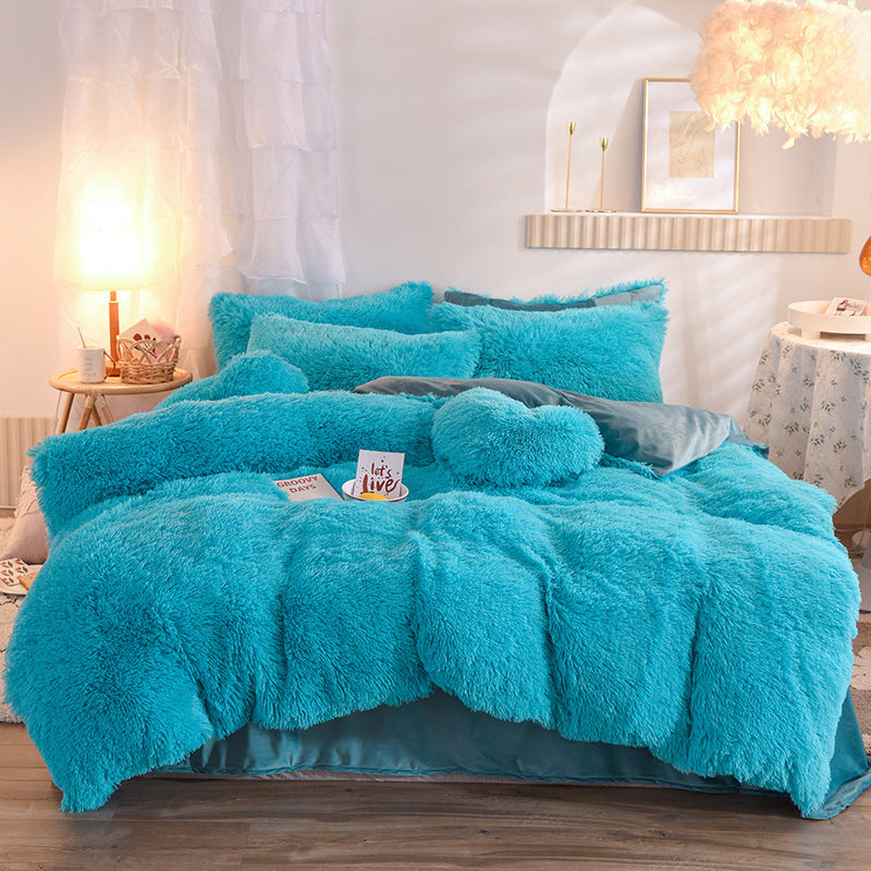 Turquoise thick fleece duvet cover set with fluffy plush texture on queen bed, matching pillows and heart-shaped cushion.