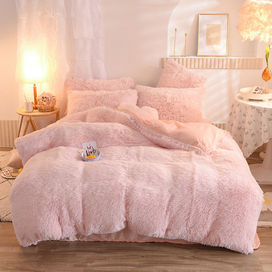 Plush thick fleece light pink duvet cover with matching pillowcases on bed in cozy room setting.