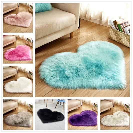 Light blue fluffy heart-shaped rug on wooden floor by beige sofa.