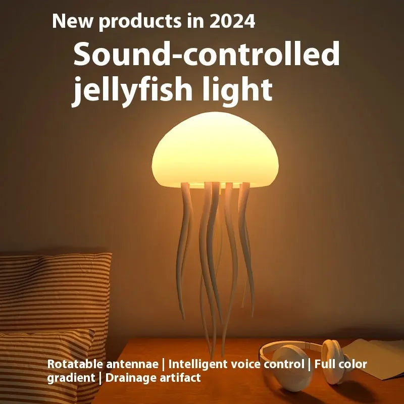 Yellow glowing jellyfish mood lamp with long tentacles on a bedside table in a dim room.