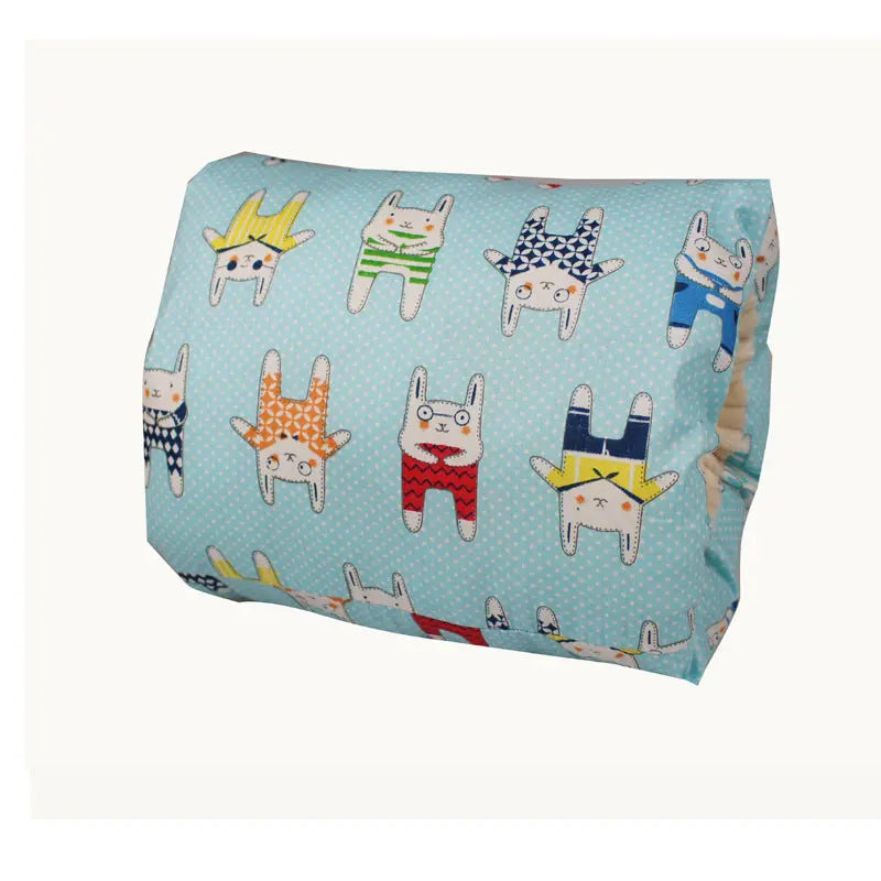 Sky blue cotton nursing arm pillow with colorful playful animal patterns.