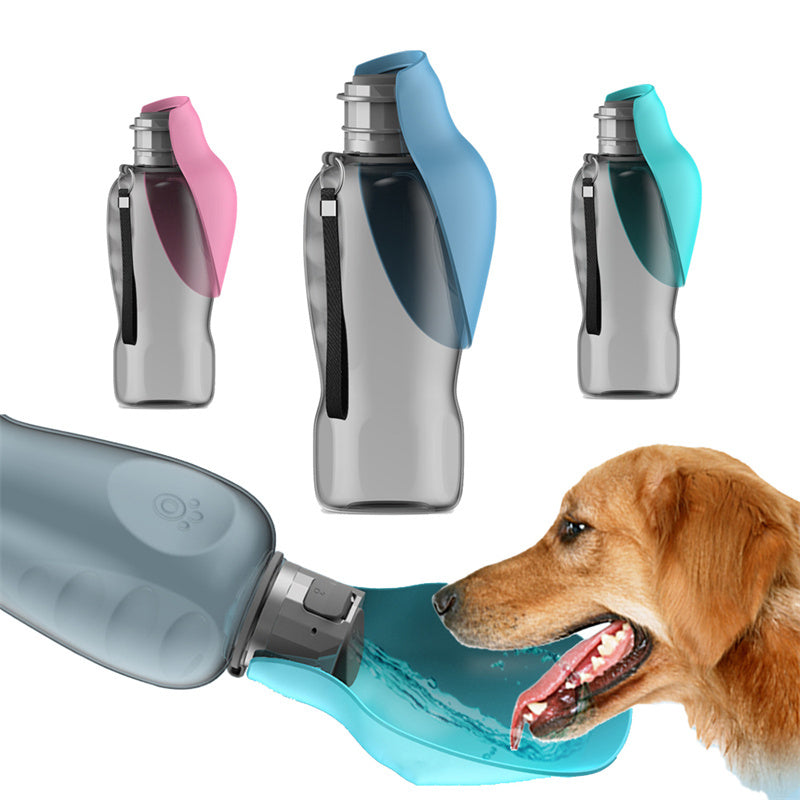Portable silver pet water bottle with foldable pink, blue, and teal silicone bowls and a dog drinking.