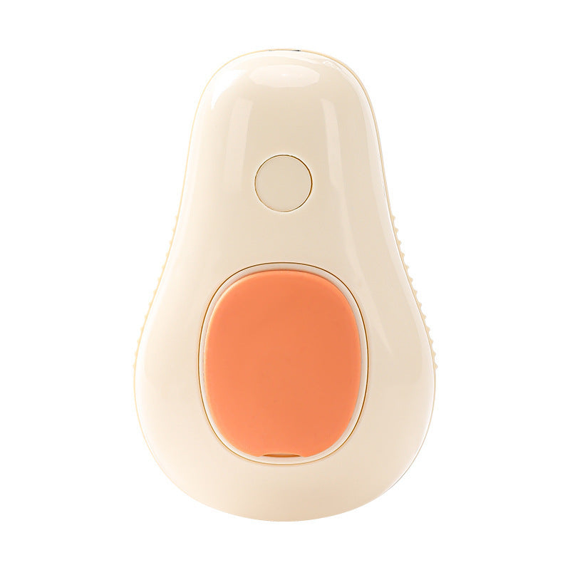 Cream white avocado-shaped electric cat brush with orange silicone grip and central button.