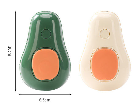 Avocado-shaped pet grooming brushes in green and cream with orange buttons, compact size shown with dimensions.