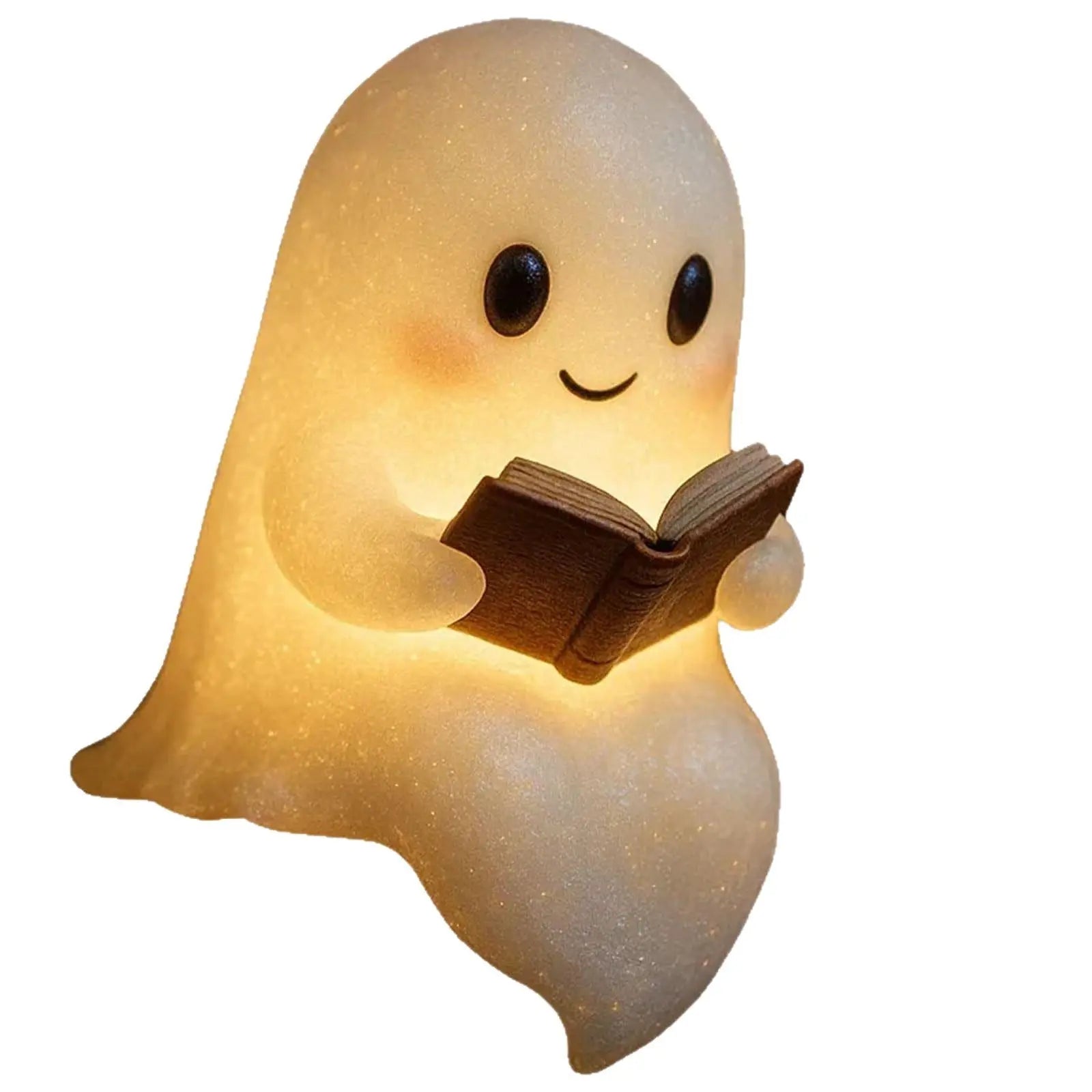Small glowing ghost-shaped night light holding an open book with warm LED light.